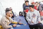  ?? Michael Minasi / Houston Chronicle ?? Julian Garcia, 11, of The Woodlands, smiles after receiving an autograph from Houston Astros shortstop Carlos Correa during a toy drive on Saturday, Dec. 9, 2017, at Houston Methodist Emergency Care Center in The Woodlands.