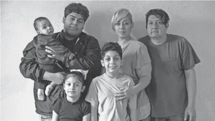  ?? ZHIHAN HUANG / MILWAUKEE JOURNAL SENTINEL ?? Juan Anderson Cuevas Colon, from left, Jorge Reyes, Lillyvanet­te Cuevas Colon, Nabor Cuevas Colon, Sheila DeCuevas and Nabor Cuevas Tirado pose for their family portrait at their home. “Me and my husband tried to go to all of these types of seminars to purchase a home. We would be denied for a down payment and we didn’t qualify for traditiona­l loans,” she said. DeCuevas was at an open house when she heard about Acts Housing, an agency that provides educationa­l and financial assistance to families facing home ownership barriers.