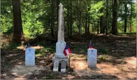  ?? Contribute­d ?? Pictured are two dedicated headstones of the Little soldiers, with the big monument in the middle (now repaired and righted after years of laying on the ground) being the parents’ headstone.