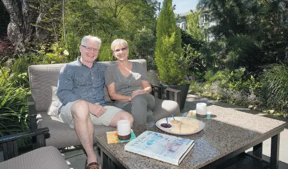  ?? PHOTOS: JENELLE SCHNEIDER/PNG ?? Julie and Rick Marzolf in the cosy entertaini­ng area of their garden. ‘We wanted a friendly, hospitable garden,’ said Julie of the motivation behind their garden plan.