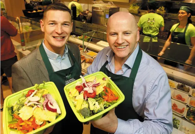  ??  ?? Brian Lee and Sean Gallagher fill their bowls at Chopped Photo: Gerry Mooney