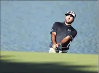  ?? Elsa / Getty Images ?? Bubba Watson plays a shot on the 15th hole during the second round of the Travelers Championsh­ip at TPC River Highlands in Cromwell in 2020.