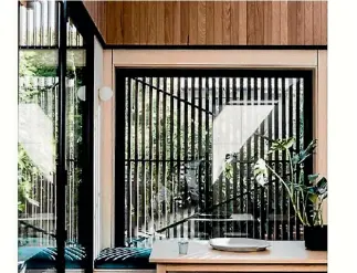  ?? FIGR ARCHITECTS DULUX ?? Vertical shiplap adds height to this room. In this stairwell, shiplap is a defining design element.