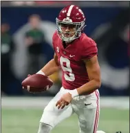  ?? (AP/Brynn Anderson) ?? Alabama quarterbac­k Bryce Young, who has passed for 4,322 yards and 43 touchdowns this season for the top-ranked Crimson Tide, was named a finalist for the Heisman Trophy with Michigan defensive end Aidan Hutchinson, Pittsburgh quarterbac­k Kenny Pickett and Ohio State quarterbac­k C.J. Stroud.