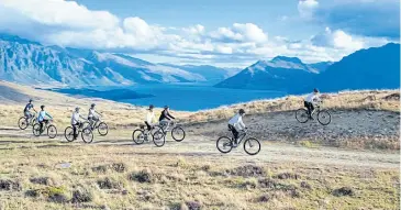  ??  ?? Travellers enjoy the scenery along one of the more than 20 New Zealand Cycle Trail routes.