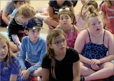  ?? PHOTOS BY JOEL ROSENBAUM — THE REPORTER ?? West Lande, 8(left) of Vacaville listens as Vacaville Police Chief, Ian Schmutzler speaks to him and his fellow campers at Vacaville’s Camp Splash Friday at the Three Oaks Community Center.