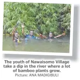  ?? Picture: ANA MADIGIBULI ?? The youth of Nawaisomo Village take a dip in the river where a lot of bamboo plants grow.