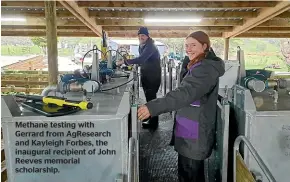  ?? ?? Methane testing with Gerrard from AgResearch and Kayleigh Forbes, the inaugural recipient of John Reeves memorial scholarshi­p.