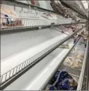  ?? Jeff Amy The Associated Press ?? Meat shelves at a Publix Super Market in Atlanta are mostly empty of chicken Tuesday. The store is limiting shoppers to two packages of chicken because of supply concerns during the pandemic.