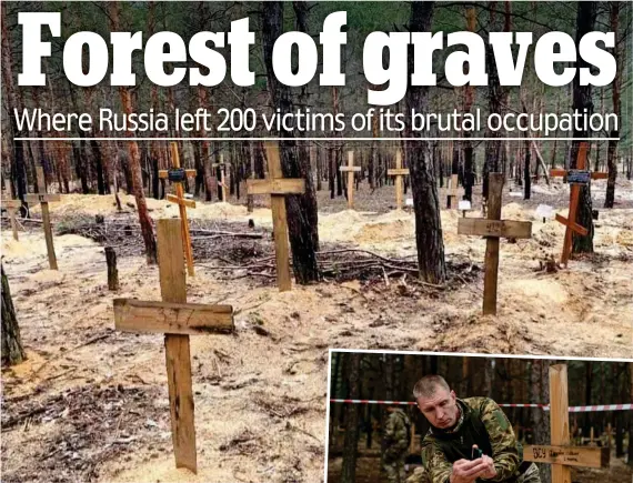  ?? ?? Burial ground: Simple wooden crosses in a forest outside Izyum