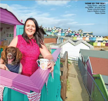  ??  ?? ‘HOME BY THE SEA’: Vicky Gunn – with her dog Millie – at one of her three colourful beach huts in Walton-on-theNaze, Essex