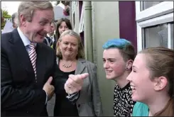  ??  ?? Blues: Enda Kenny meets youngsters in Glenties, Donegal