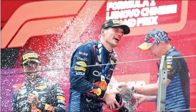  ?? WARNING: EXCESSIVE CONSUMPTIO­N OF ALCOHOL CAN DAMAGE YOUR HEALTH PHOTO: AFP ?? Red Bull Racing’s Max Verstappen, center, celebrates on the podium after winning the Chinese Grand Prix in Shanghai yesterday.