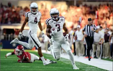  ?? AP PHOTOS ?? Texas A&M’s Christian Kirk (3) runs down the sideline before scoring a touchdown against Arkansas during the first half of an NCAA college football game Saturday, in Arlington, Texas.