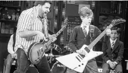  ?? MATTHEW MURPHY/COURTESY PHOTO ?? Dewey (Rob Colletti, left) teaches Zack (Phoenix Schuman) a thing or two about being a rock star in the touring production of Broadway musical “School of Rock.”