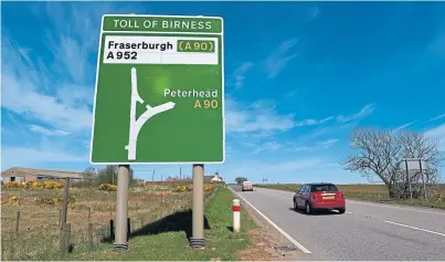  ??  ?? SIGN OF THE TIMES: The latest plans for the A90 include a dual carriagewa­y at danger spot Toll of Birness