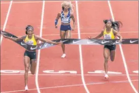  ?? AP ?? Jamaica's Elaine Thompson-Herah (L) wins the 100m at the Diamond League meet in Eugene.