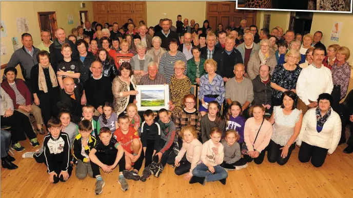  ?? Photo by Eamonn Keogh ?? Siobhan McSweeney and Mary O’Connor and local parishione­rs making a presentati­on of a painting by artist Phil O’Grady to former Kilcummin Parish priest Fr Eamonn Mulvihill at a farewell function in Kilcummin Hall on Wednesday night.