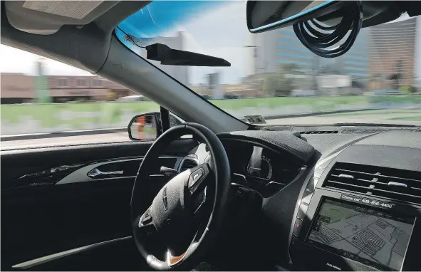  ?? — THE ASSOCIATED PRESS FILES ?? An autonomous car drives along a course during the Consumer Electronic­s Show in Las Vegas.