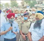  ??  ?? Victims Amandeep Singh, alias Aman Fauji (left), and Prabhjit Singh.; and (above) SP investigat­ion Jagjit Singh Walia urging protesters to lift dharna in Patti on Thursday.
HT PHOTOS