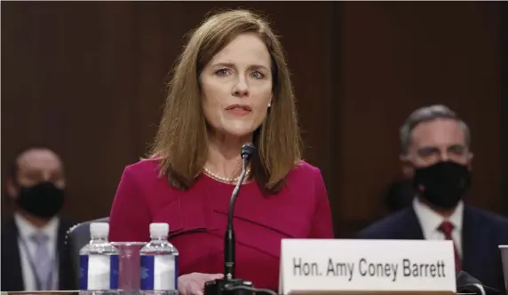  ?? GETTY ImAgES pHOTOS ?? SMART AND KIND: Supreme Court Justice nominee Judge Amy Coney Barrett is sworn in during the Senate Judiciary Committee confirmati­on hearing on Monday in Washington, D.C.