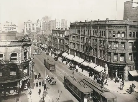  ??  ?? This photo, part of Eric Waschke’s collection and available for sale at the Vancouver Rare Book, Photograph and Paper Show this weekend, shows the corner of Granville and Georgia as it looked in the early 1920s. The old Hudson’s Bay building dates the...