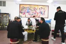  ??  ?? People at a restaurant in Yunnan province. An AP investigat­ion has found the Chinese government is strictly controllin­g all research into its origins. (AP)