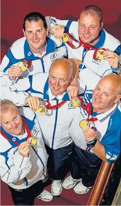  ?? ?? Team Scotland’s men’s singles gold medal winner Darren Burnett, bottom left, with the gold medal-winning men’s fours team David Peacock, centre, Alex Marshall, bottom right, Neil Speirs and Paul Foster at the 2014 Commonweal­th Games in Glasgow.