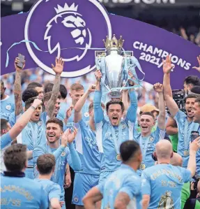  ?? DAVE THOMPSON/AP ?? Manchester City players celebrate after winning the 2022 English Premier League title May 22 at Etihad Stadium in Manchester.