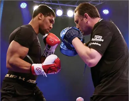  ??  ?? Wembley workout: Anthony Joshua and coach Rob McCracken during an open session yesterday