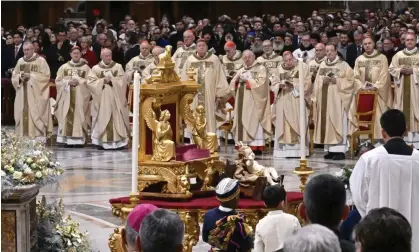  ?? ?? The pope presided over the Christmas Eve midnight mass at St Peter’s Basilica in the Vatican. Photograph: Maria Laura Antonelli/REX/ Shuttersto­ck