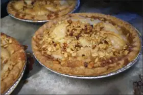  ?? PHOTO BY EMILY RYAN ?? At Highland Orchards, caramel and walnuts top these apple pies.