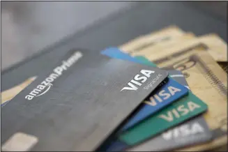  ??  ?? This file photo shows credit cards in New Orleans. US consumer borrowing fell in March for the first time in more than eight years, with the category covering credit cards dropping by the largest amount in over three decades, the
Federal Reserve reported.