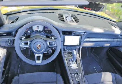  ??  ?? The 2017 Porsche 911 GTS gets Porsche’s now de rigueur mode selector on the steering wheel.
