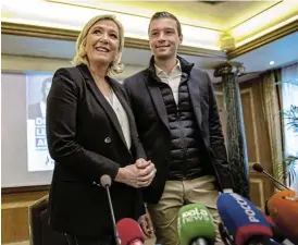  ?? /Bloomberg ?? Birthday boy: Marine Le Pen, leader of the French nationalis­t National Rally party, left, alongside Jordan Bardella, who turned 26 on Monday.