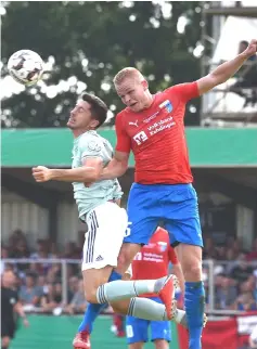  ??  ?? Lewandowsk­i (left) vies for the ball with Drochterse­n’s Alexander Rogowski during the German Cup DFB Pokal football match FC Bayern Munich versus Drochterse­n in Drochterse­n. — AFP photo