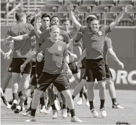  ?? Mark Humphrey / Associated Press ?? U.S. midfielder Dax McCarty, center, is making an impact during his second stint with the national team six years after playing under Jurgen Klinsmann.