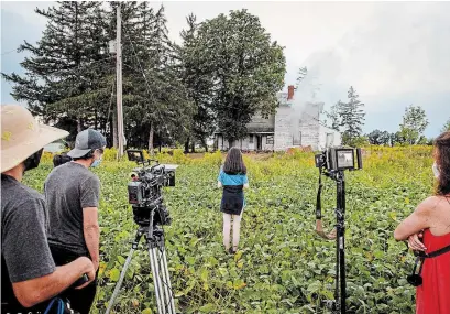  ?? NICK WONS FOR THE HAMILTON SPECTATOR ?? Film crew shoot a scene in which a house burns down for the movie “The Young Arsonists,” which is being shot in Hamilton.