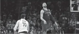  ?? AP ?? Cleveland Cavaliers guard Max Strus tracks his game-winning basket, next to Dallas Mavericks guard Luka Doncic, in Tuesday’s NBA game in Cleveland, Ohio. The Cavs won 121-119.