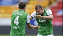  ??  ?? Ryan Porteous, right, was delighted that Hanlon was finally capped at the age of 30