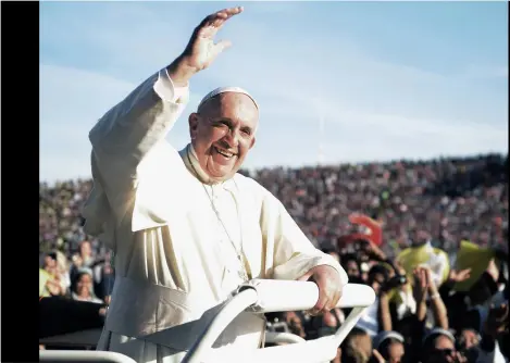  ??  ?? PREVIOUS PAGE: Pope Francis at the Apostolic Palace in Vatican City
LEFT: Pope Francis greets crowds in the stadium Artemio Franchi in Florence, Italy. Photo by Laura Lezza/Getty
