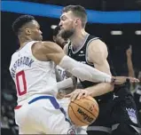  ?? JOSÉ LUIS VILLEGAS Associated Press ?? CLIPPERS GUARD Russell Westbrook looks to slow down Kings forward Domantas Sabonis.