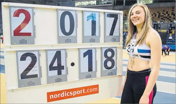  ?? Pictures: Bobby Gavin ?? HAVING THE TIME OF HER LIFE: Alisha Rees alongside confirmati­on of her Scottish U20 record at 200m indoors.