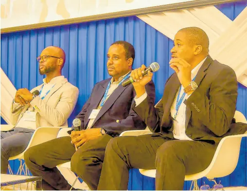  ?? CONTRIBUTE­D ?? Mazahurlt Davis (right), director of network services at Flow, responds to a question from the audience during a recent IEEE Workshop at UTech, Jamaica. Other panellists are Shonari Bullock (left), former manager at Digicel, and Andre Palmer, representi­ng Symptai Consulting.