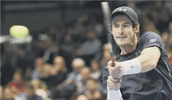  ??  ?? 2 Andy Murray plays a doublehand­ed backhand during his win over Slovakia’s Martin Klizan in Vienna.