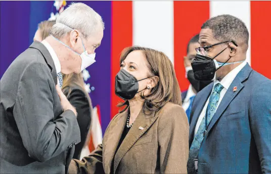  ?? Stefan Jeremiah The Associated Press ?? Vice President Kamala Harris speaks Friday with New Jersey Gov. Phil Murphy, left, as Environmen­tal Protection Agency Administra­tor Michael Regan looks on after an event highlighti­ng Newark’s efforts to replace lead water pipes.