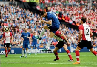  ?? FRANK AUGSTEIN/AP ?? Chelsea’s Alvaro Morata, centre, heads home his side’s second goal to secure their spot in the FA Cup final.