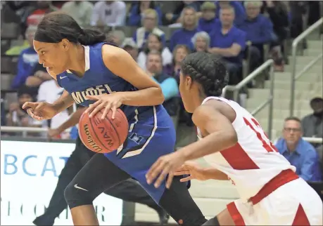  ?? Steven Eckhoff / RN-T ?? Model’s Victaria Saxton moves past Laney’s Jaiden Hamilton during Saturday’s Class AA semifinal game in Milledgevi­lle. The Lady Devils lost 68-51.