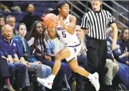  ?? Stephen Dunn / Associated Press ?? UConn guard Crystal Dangerfiel­d keeps the ball in bounds during the first half of a game against Cincinnati on Jan. 9 in Storrs.