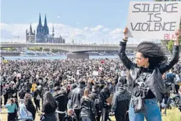  ?? MARTIN MEISSNER/AP 2020 ?? Thousands of people demonstrat­e June 6 in Cologne, Germany, to protest against systemic racism and the killing of George Floyd.